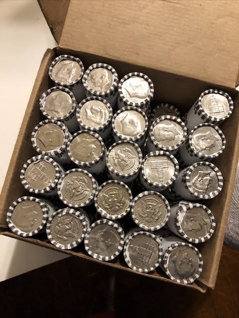 A box of half-dollar rolls ready for coin roll hunting at Haven Coin & Jewelry