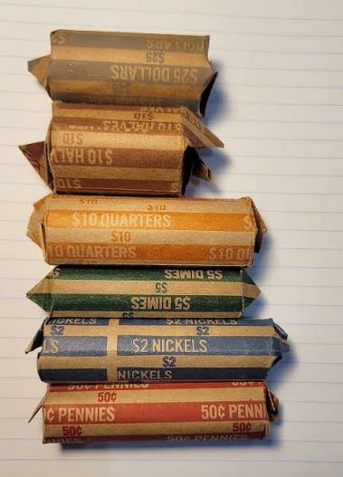 Customer-wrapped coin rolls being searched for collectible coins