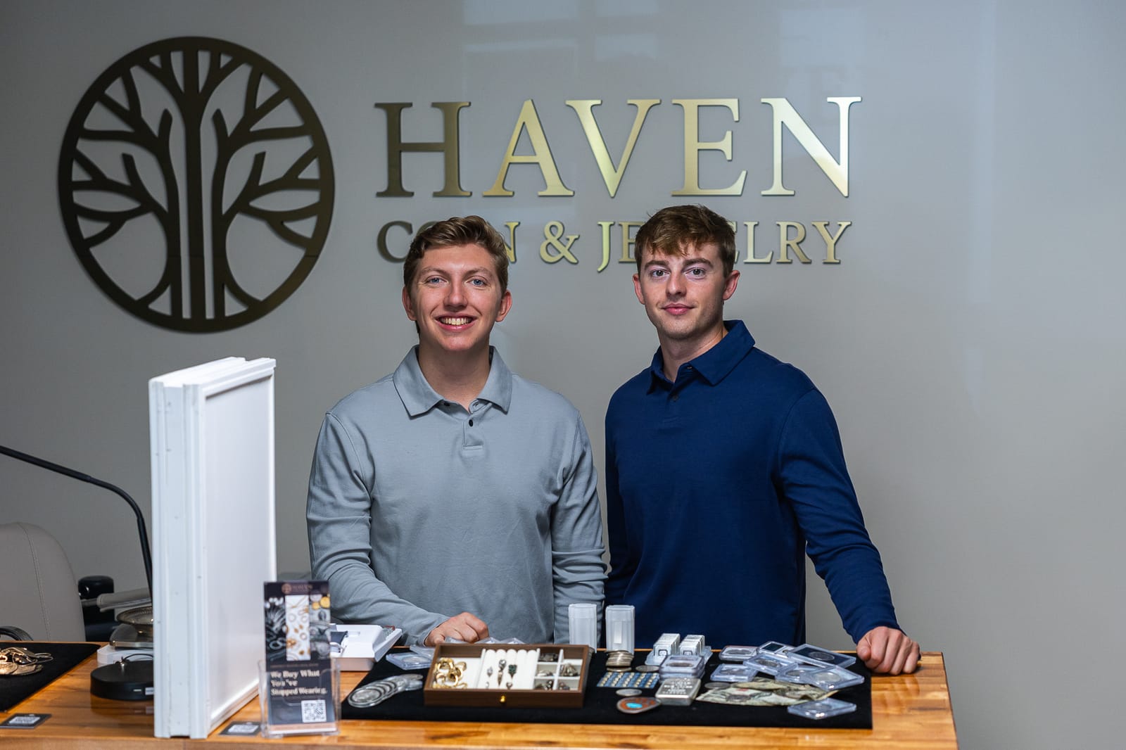 Haven Coin & Jewelry owners standing at the buying counter, Hamden CT